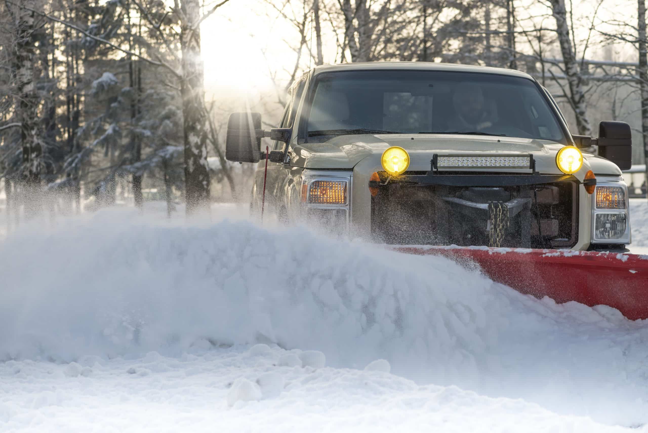 Truck plowing the snow | A-Z Landscaping