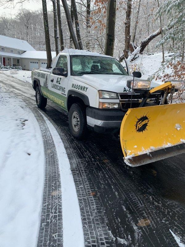 A-Z Landscaping pick up truck with a snow plowing | A-Z Landscaping