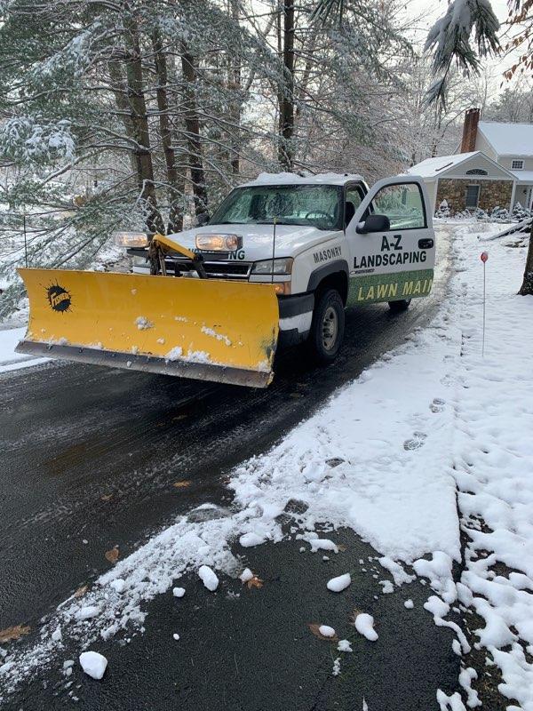 A-Z Landscaping pick up truck with a snow plowing | A-Z Landscaping