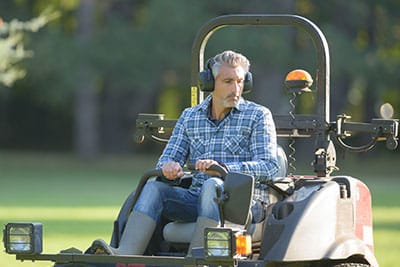 Man driving professional mower | A-Z Landscaping